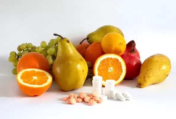 Vitamins in Fruit and Tablets for Potency